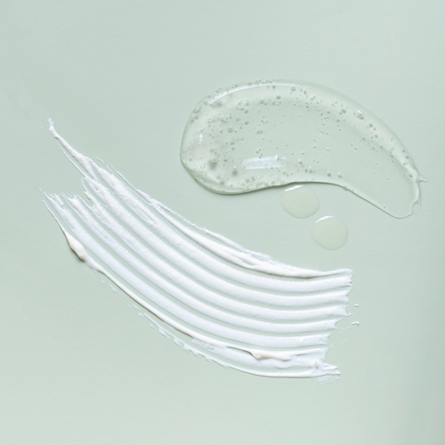 White cream on a duck egg green background